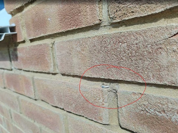 Metal object in wall